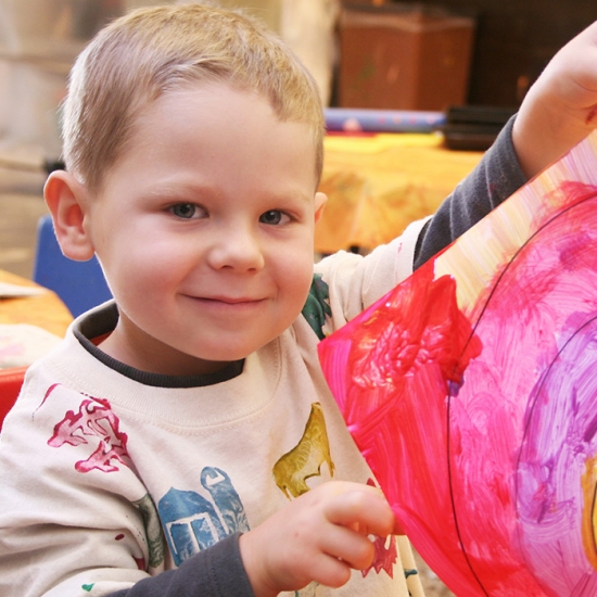 Gift Aid Thumbnail - Child with painting