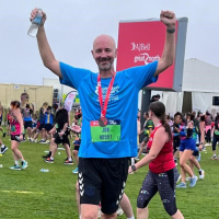 Jon celebrating crossing the Great North Run finish line