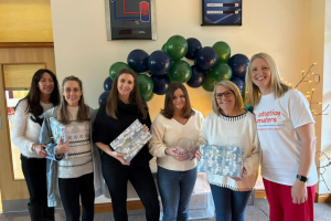 Elaine Trohear of Adoption Matters with the John Pass Jewellers team, who are supporters of the charity.